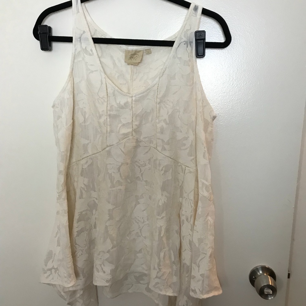 Peplum waisted off white tank.